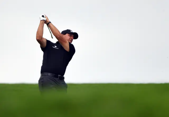 Phil Mickelson plays a shot on the 12th hole