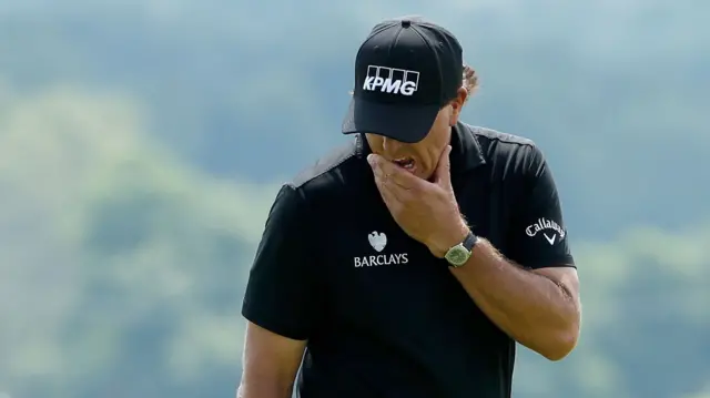 Phil Mickelson reacts during his first round