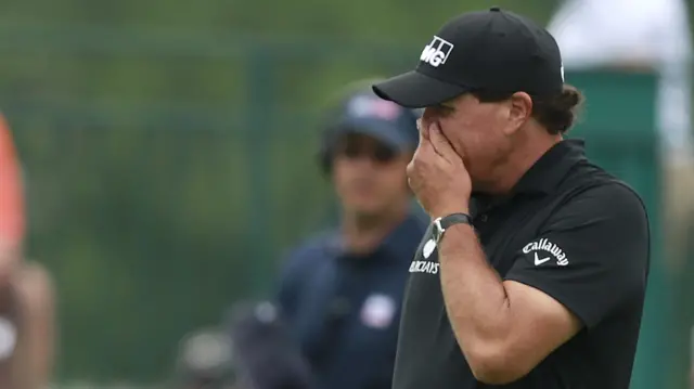 Phil Mickelson reacts to a missed putt