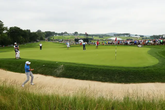 Dustin Johnson hits a bunker shot