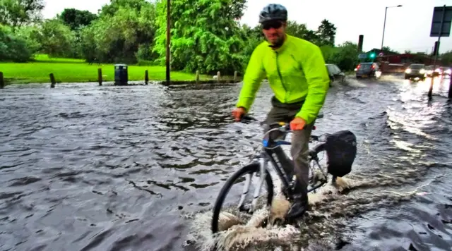 cyclist caught in floods