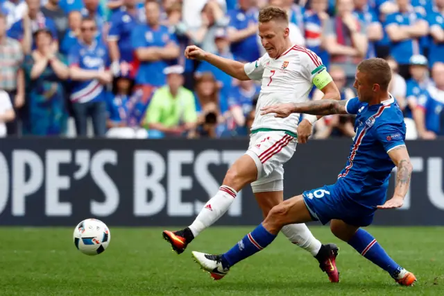 Ragnar Sigursson tackles Balazs Dzsudzsak