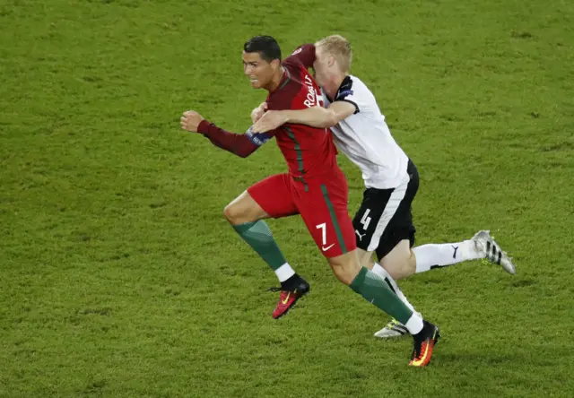 Martin Hinteregger fouls Cristiano Ronaldo