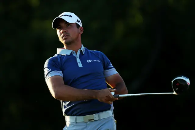 Jason Day watches the ball