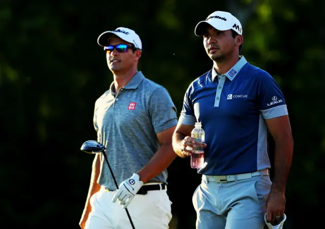 Jason Day and Adam Scott on day two