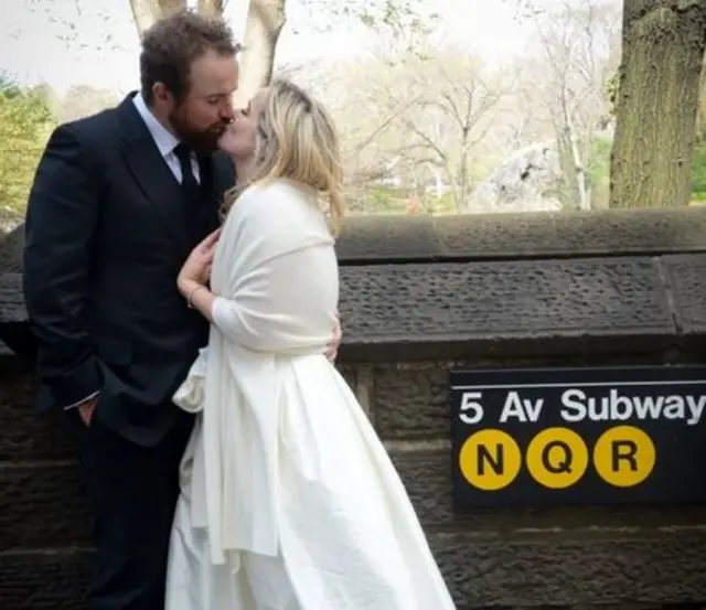 Shane Lowry kisses his bride