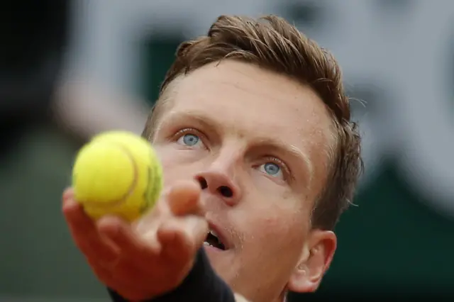 Tomas Berdych serves