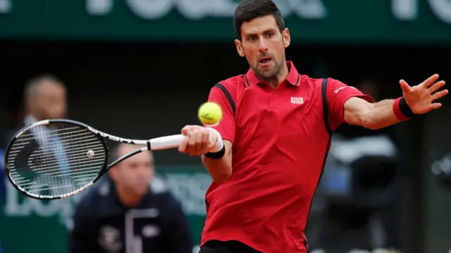 Novak Djokovic hits a forehard