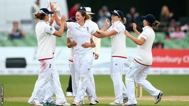 Kate Cross celebrates with England team