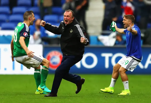 Michael O'Neill celebrates after his team score against Ukraine