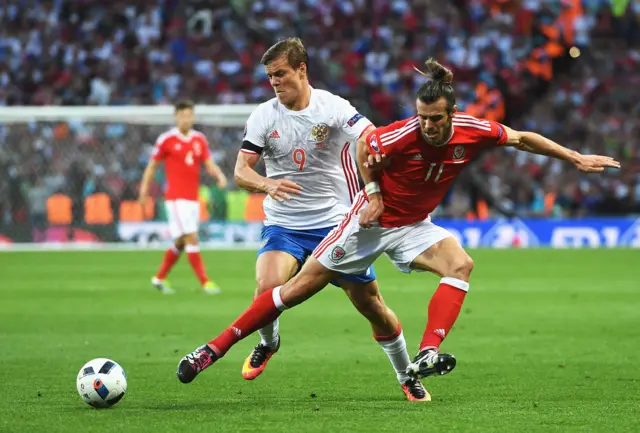 Gareth Bale of Wales and Aleksandr Kokorin battle for the ball