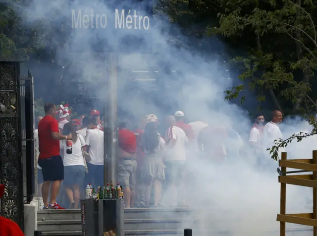 Poland fans react to tear gas