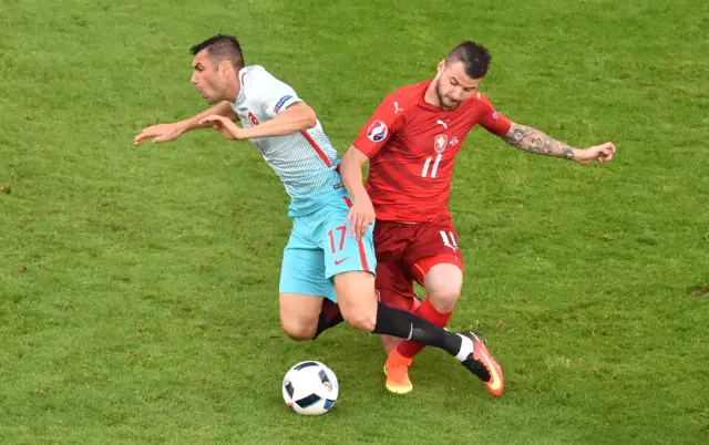 Burak Yilmaz vies with Czech Republic's defender Daniel Pudil