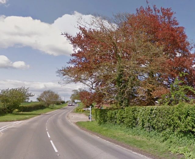 The A1062, showing a bus in the distance