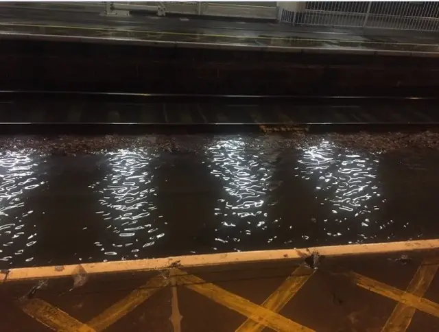 Network Rail handout of the flooded Manor Park station after heavy rain.