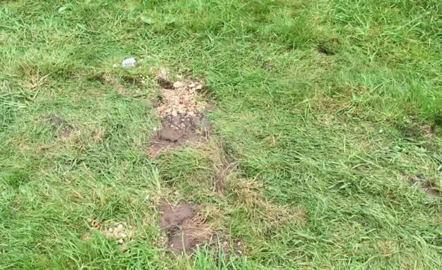 Tyre marks in church graveyard