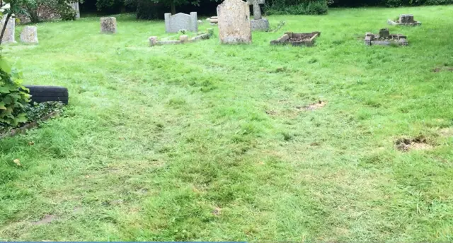 Tyre marks in church graveyard