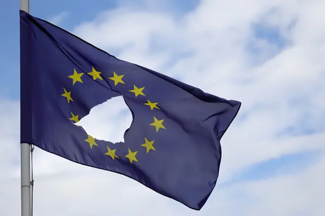 EU flag with a hole in it