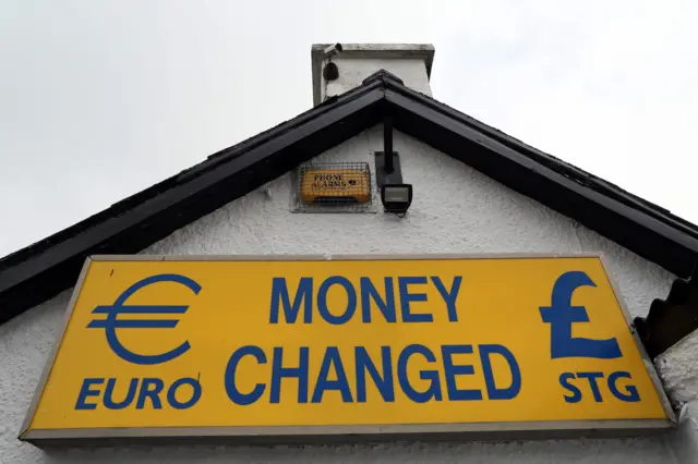 A sign near the Irish border that reads 'Money exchanged'