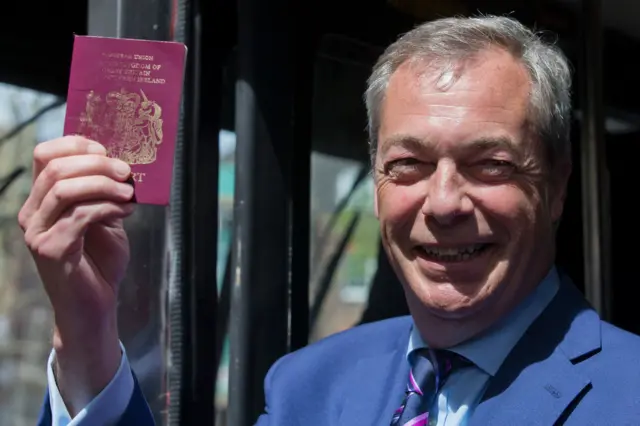 Nigel Farage holding a passport