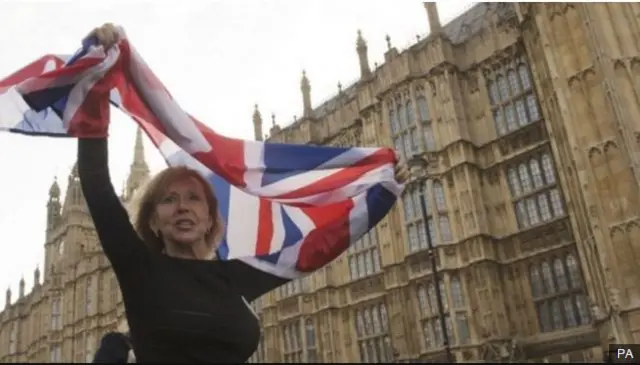 Woman waves union flag