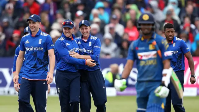 England's players celebrate running out Shanaka