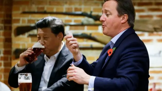 Chinese President Xi Jinping and David Cameron drinking in a pub last year