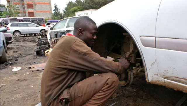 Mechanic checking brake pads