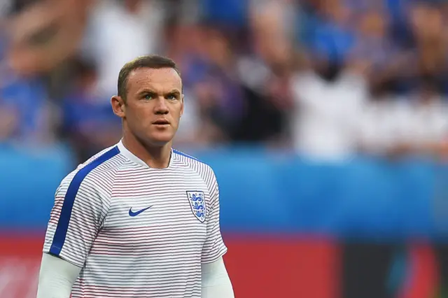 Wayne Rooney warms up