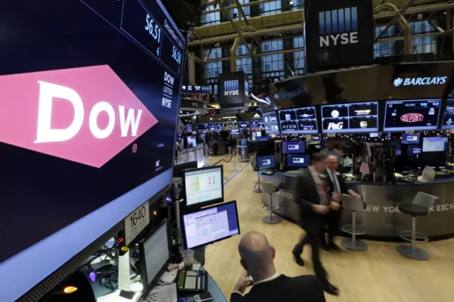 Dow and Dupont company names above their trading posts on floor of the New York Stock Exchange