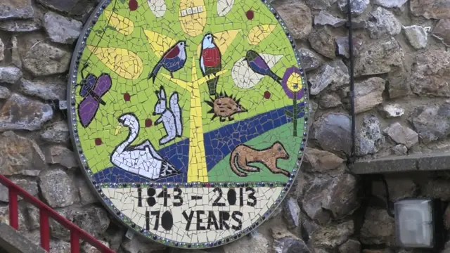 Tipton St John Primary School plaque