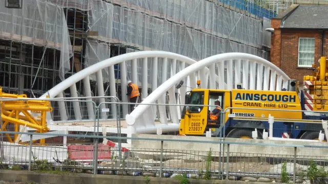 Bridge in Bedford - a curve-sided, white iron construction