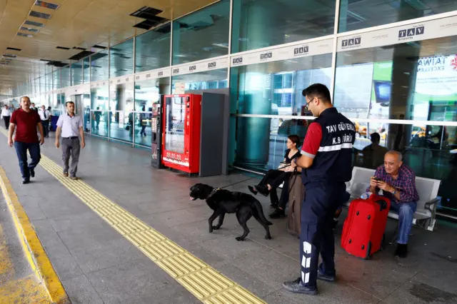 A K9 unit guards one of the entrance of Turkey"s largest airport, Istanbul Ataturk, following yesterday"s blast June 29, 2016.