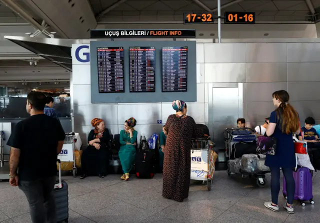 Passengers wait for their flights following yesterday"s blasts June 29, 2016.