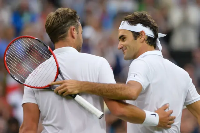 Roger Federer and Marcus Willis embrace