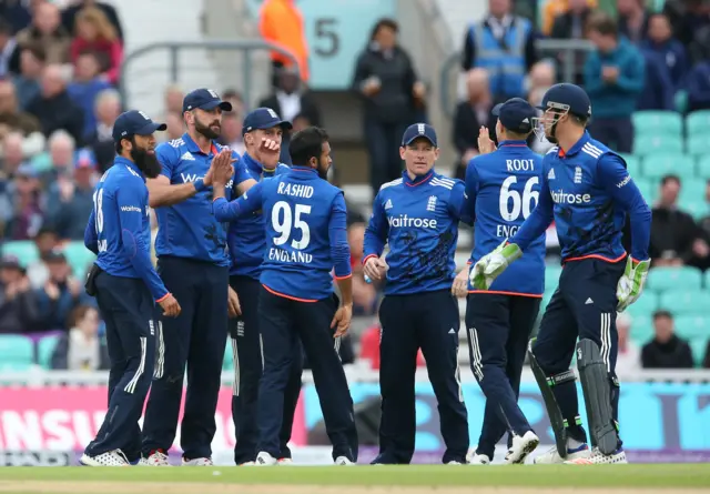 England celebrate taking the wicket of Mendis