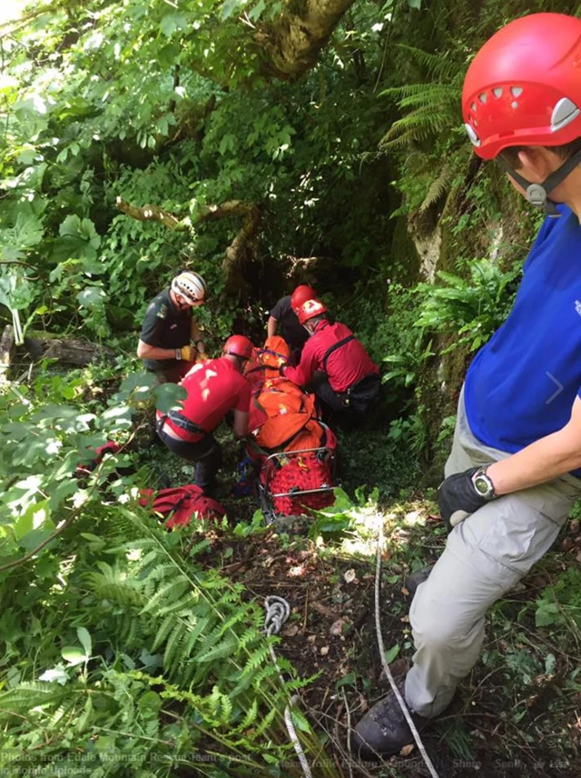 Edale Mountain Rescue Team help a casualty at Chee Dale