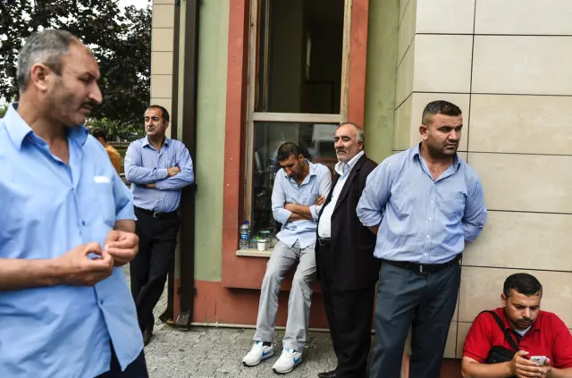 Relatives of victims wait outside a forensic medicine building close to Istanbul"s airport on June 29, 2016