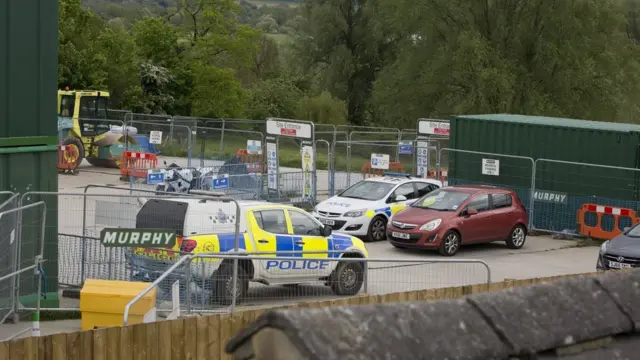 Police cars at Sharnbrook site