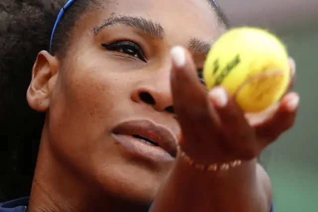 Serena Williams prepares to serve