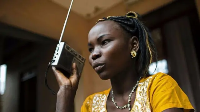 Woman listening to the radio