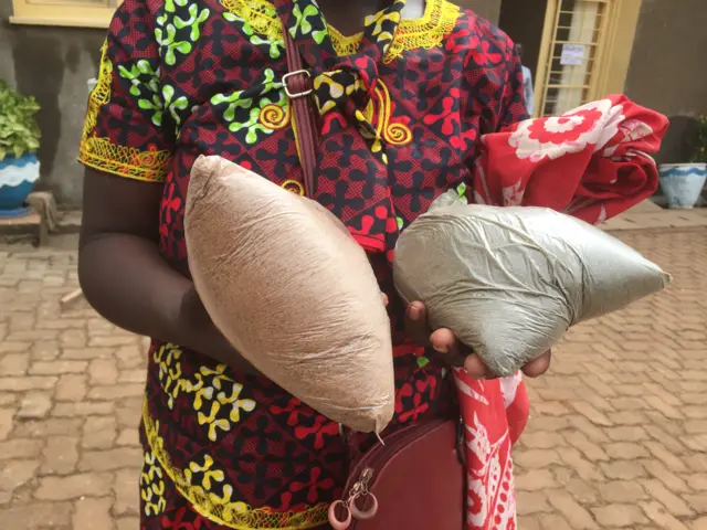 Woman holding bag of seeds