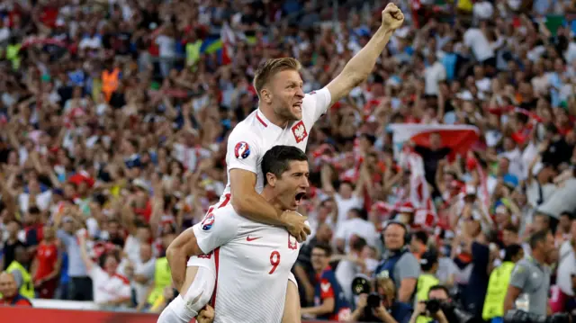 Robert Lewandowski and Jakub Blaszczykowski celebrate