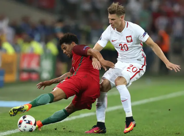 Lukasz Piszczek tackles Eliseu