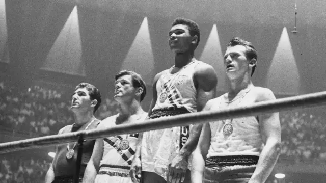 1960 Olympic medals for light heavyweight boxing on the winners' podium at Rome