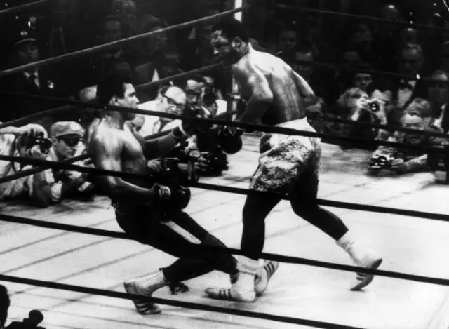 Joe Frazier (left) in action against Muhammad Ali