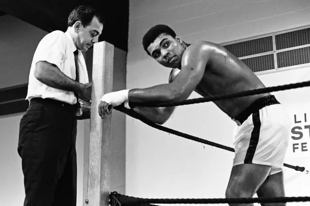 Muhammad Ali (R) (formerly Cassius Clay), is seen here with his trainer Angelo Dundee ahead of his fight with Ernie Terrell at the Astrodome, Houston, Texas, on 6 February, 1967