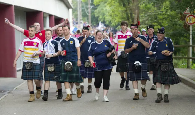 Members of the Tartan Army head in to the stadium in Metz.