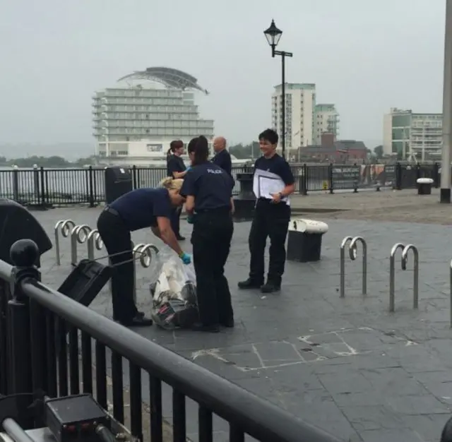 Police officers searching outside the Senedd