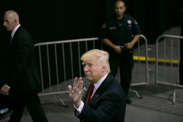 Republican Presidential candidate Donald Trump waves as he leaves a campaign rally on June 2, 2016 in San Jose, California.